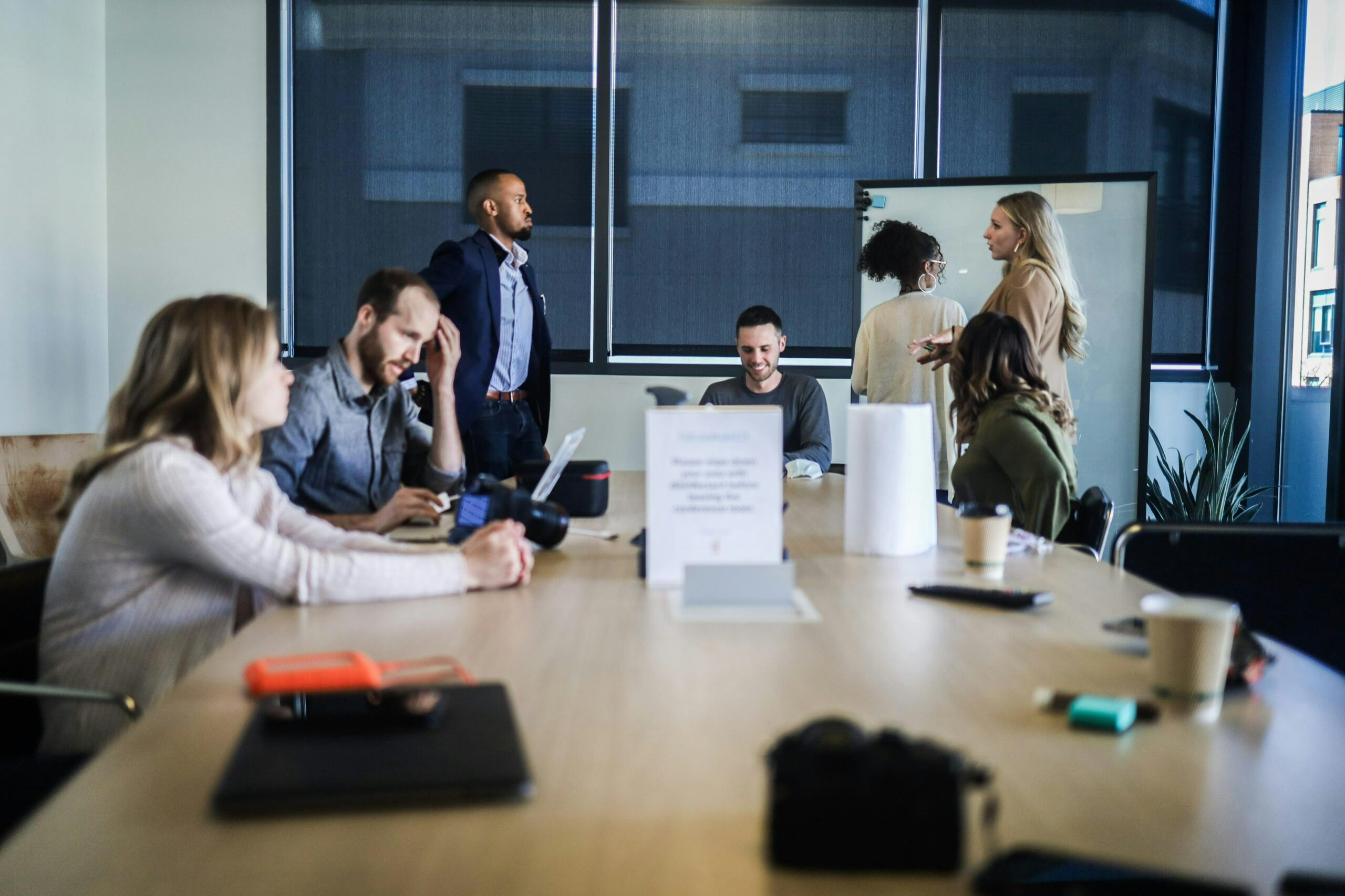 A group of coworkers meeting in a conference room